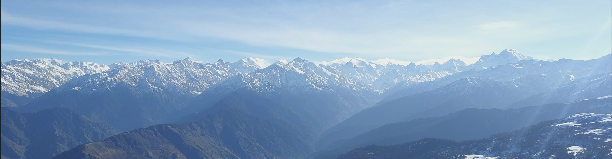 Snow-covered Himalayan peaks viewed from Kedarkantha.